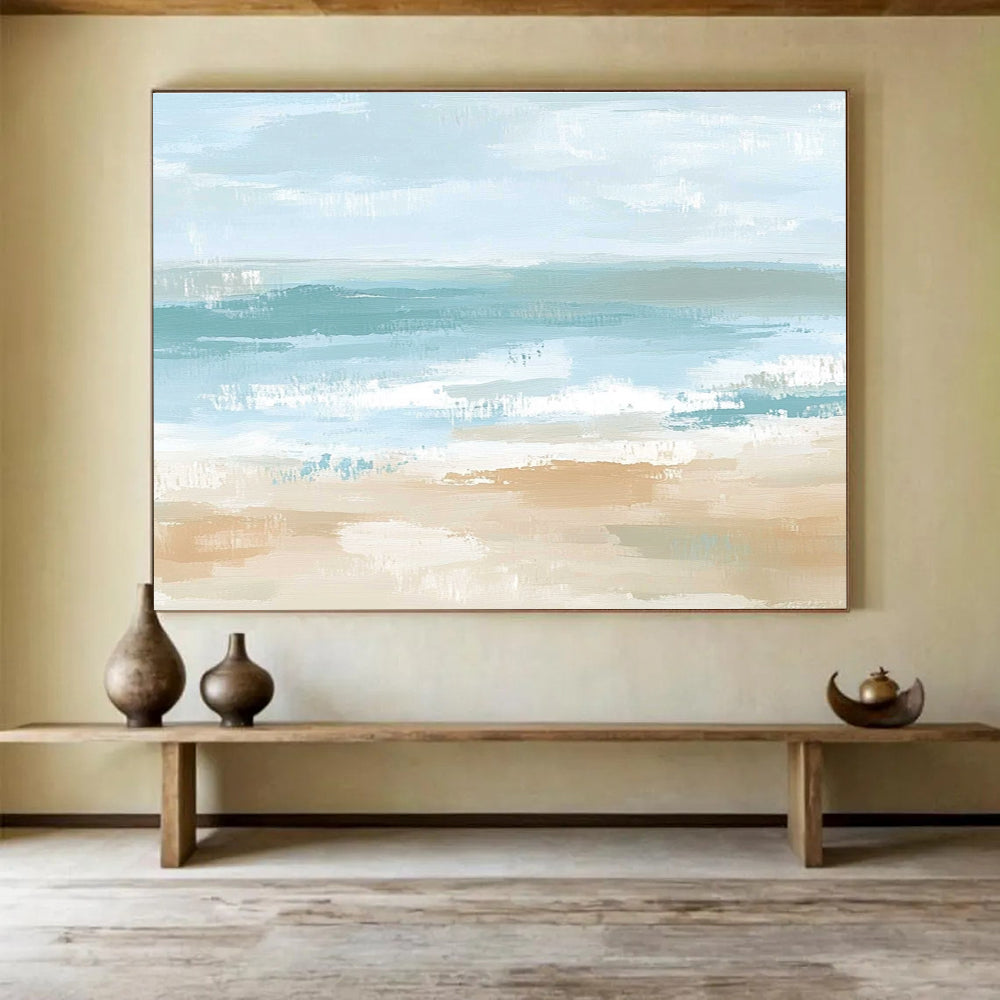 A large abstract painting depicting a serene coastal landscape in soft pastel colors, evoking tranquility with gentle waves and a sandy shore.SC545