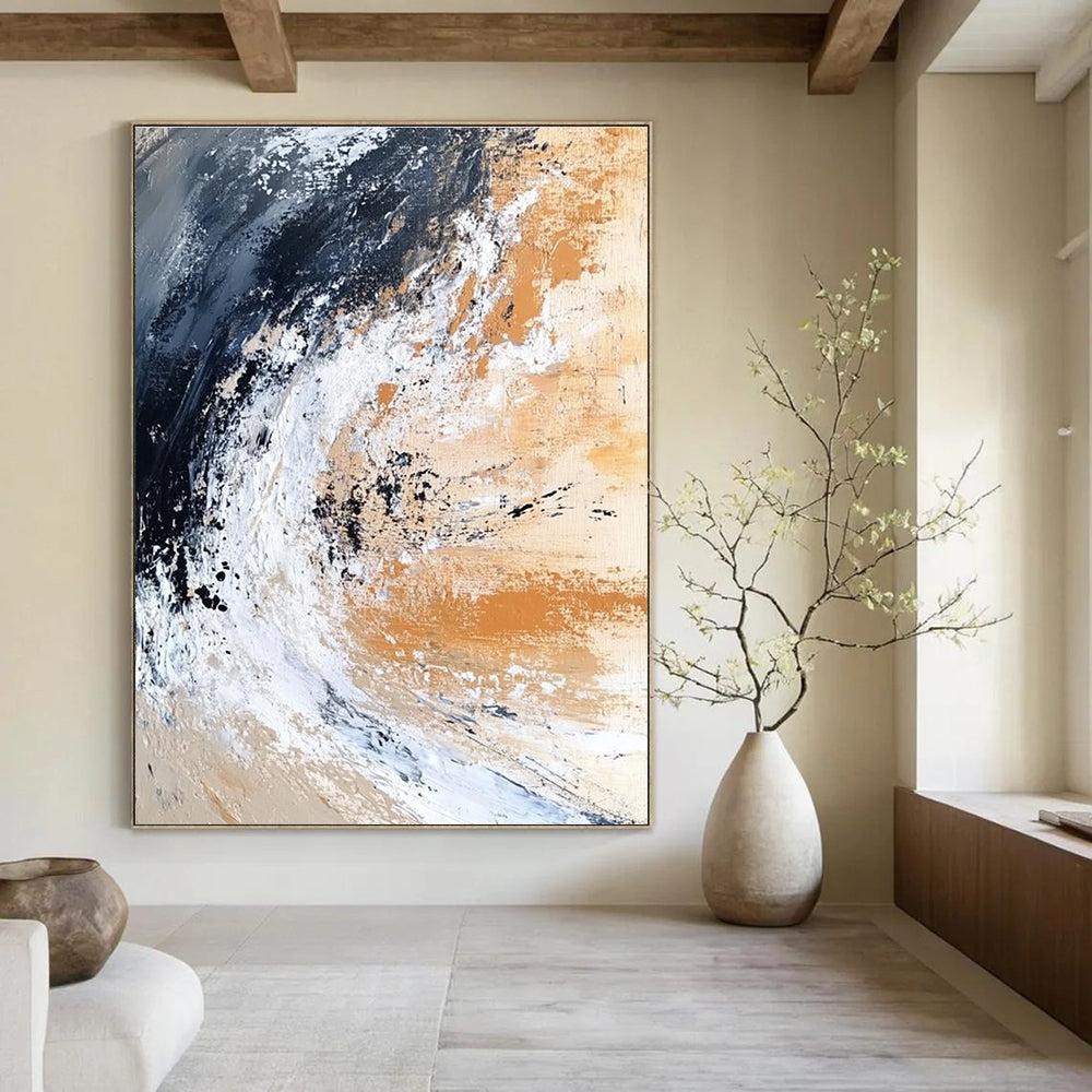 Large abstract painting depicting an ocean wave crashing on the shore in dark black and white with beige brown gray and rust orange.STSC555