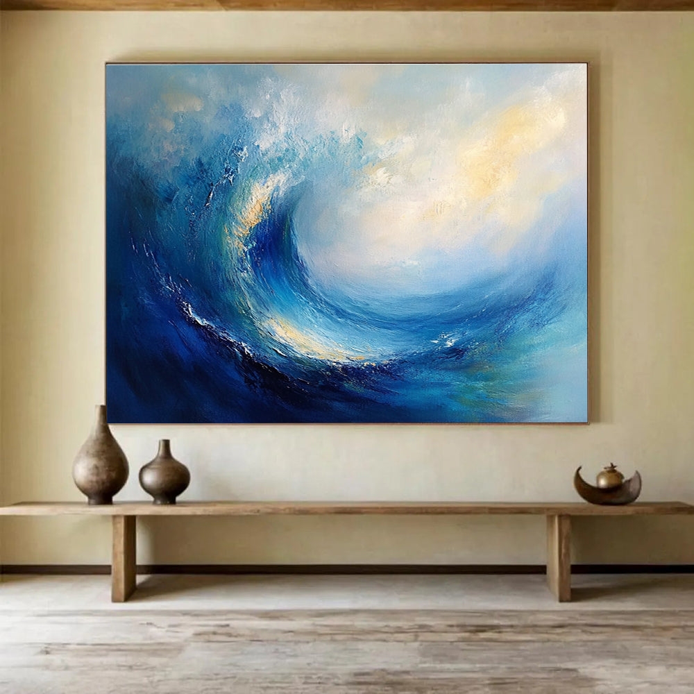 Large abstract oil painting of an ocean wave featuring blue and teal colors with thick brush strokes and white clouds in the background.SC108