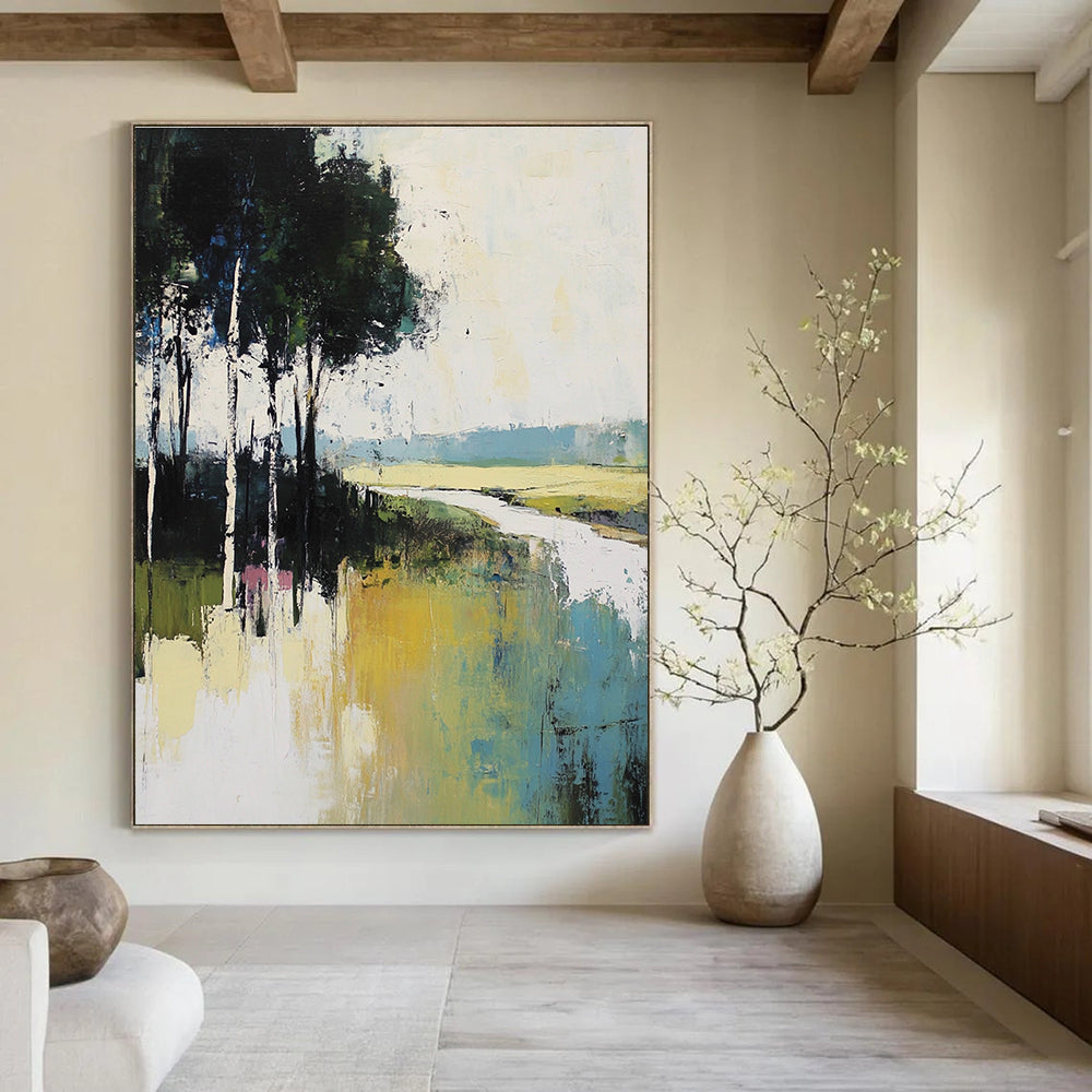 Large abstract painting featuring muted greens blues and whites depicting tranquil nature with tall trees and a serene river flowing through grassy fields.STSC100