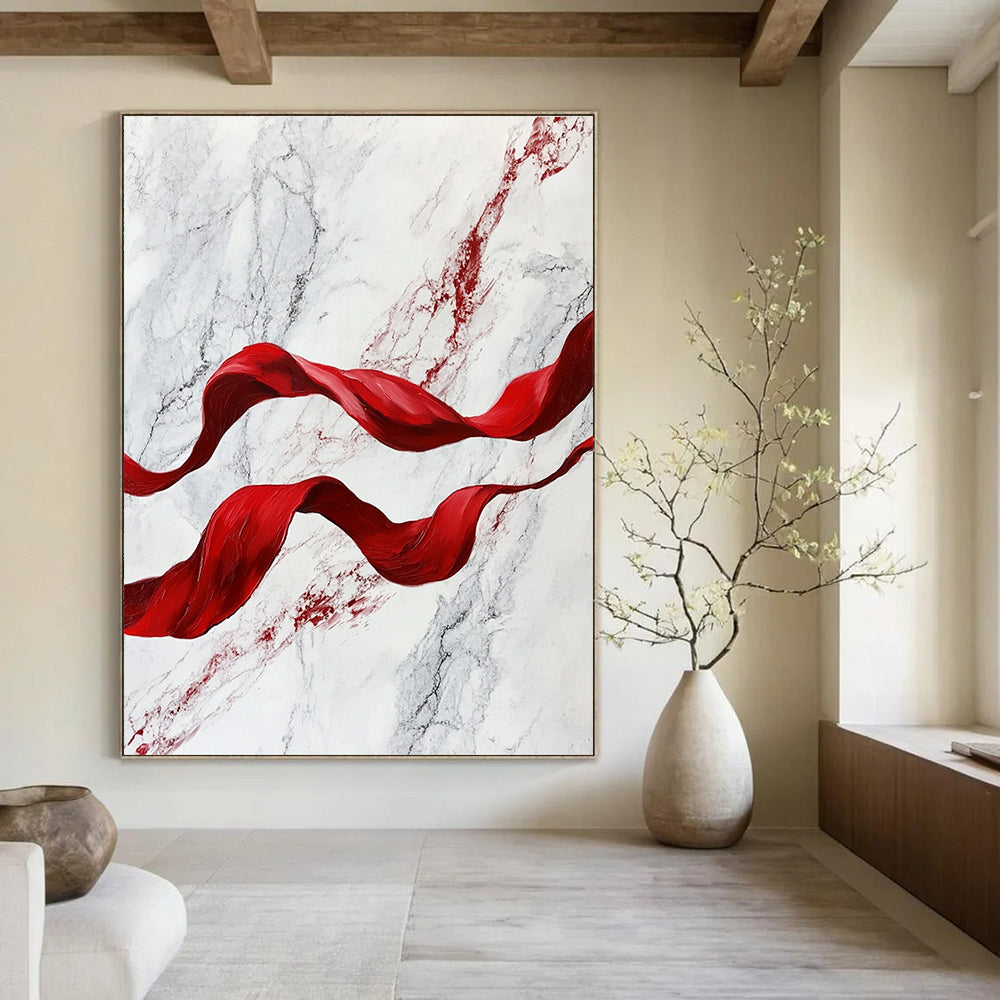 A large abstract painting featuring red flowing ribbons on white marble, evoking movement and elegance in a captivating blend of color and texture.STSC1416
