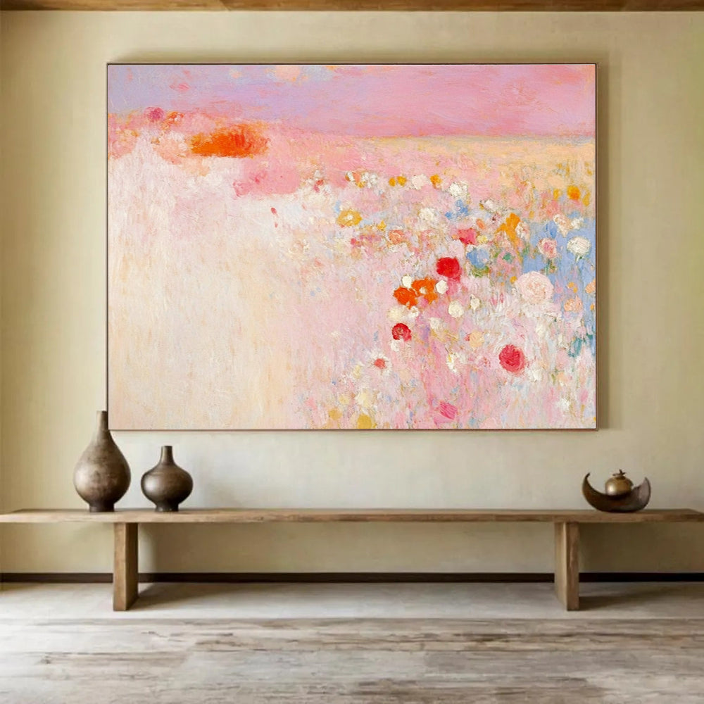 Large abstract painting in soft pink and white with hints of red and yellow evokes springtime calmness amidst a blooming field.SC350