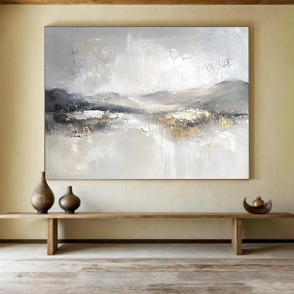 Large abstract painting featuring soft gray and white tones with subtle textures of snow-covered hills and ethereal clouds for a calming atmosphere.SC083