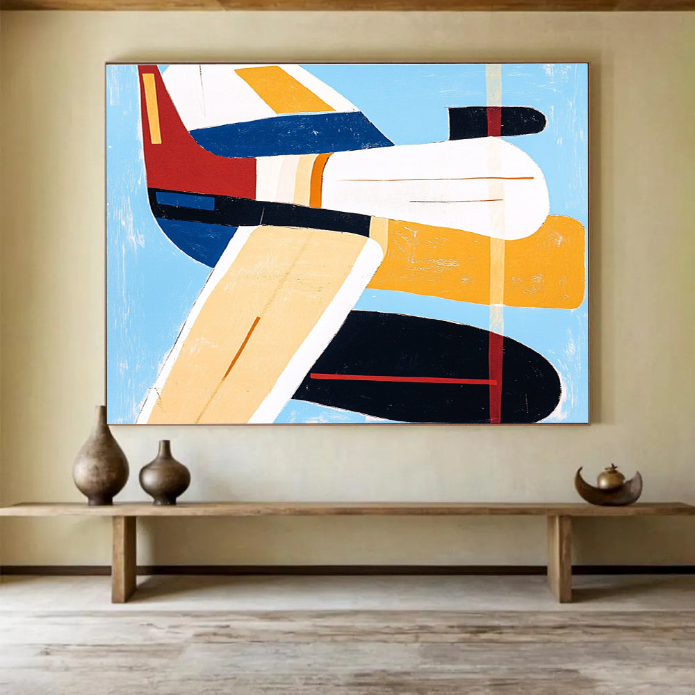Large abstract painting of an airplane with bold lines and vibrant colors including blue, red, yellow, and orange in the style of Mary Blair.SC040