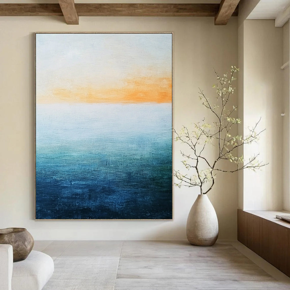 Abstract landscape featuring a vast water expanse in blue and green hues beneath a soft orange sky with a minimalist oil painting style.STSC074