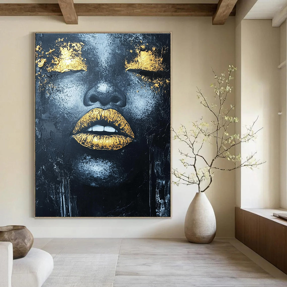 Large abstract acrylic painting of an African woman's lips with gold leaf highlights and textured black background.STSC1276