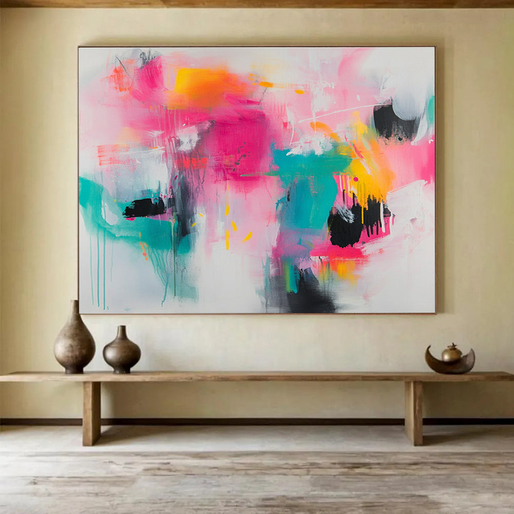 Large abstract painting featuring vibrant splashes of pink teal and yellow on a white background with loose brushstrokes and chaotic shapes.SC387