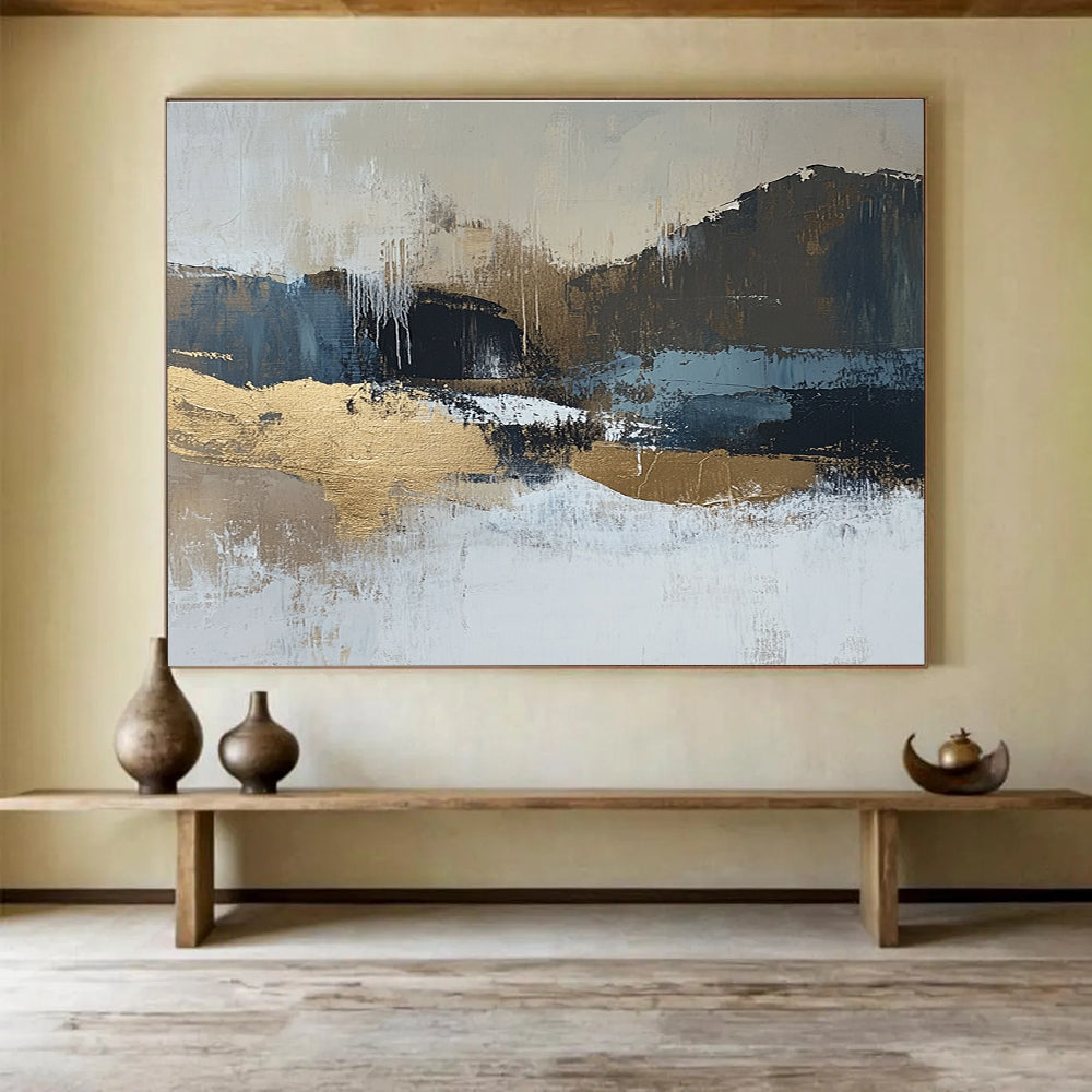 Large abstract painting in beige and dark blue tones with gold accents showcasing a minimalist winter landscape in a neutral color palette.SC226