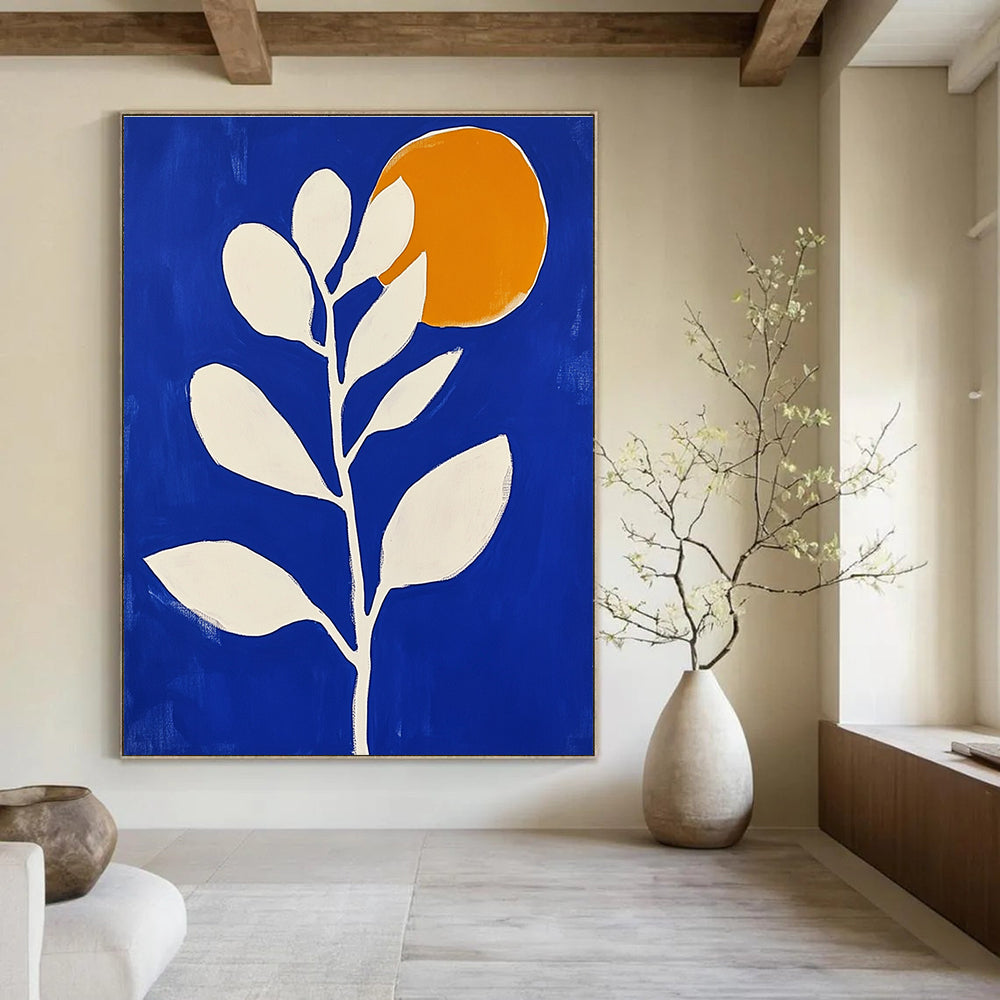 Large abstract painting in blue and white featuring minimalist flower shapes and an orange sun with bold brush strokes.STSC920