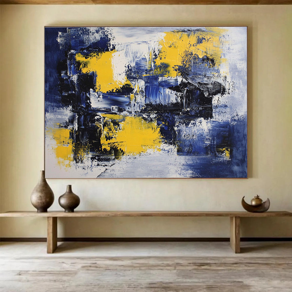 Large abstract painting featuring deep blue, white, and yellow accents with impressionist brush strokes on canvas ideal for modern wall decor.SC031