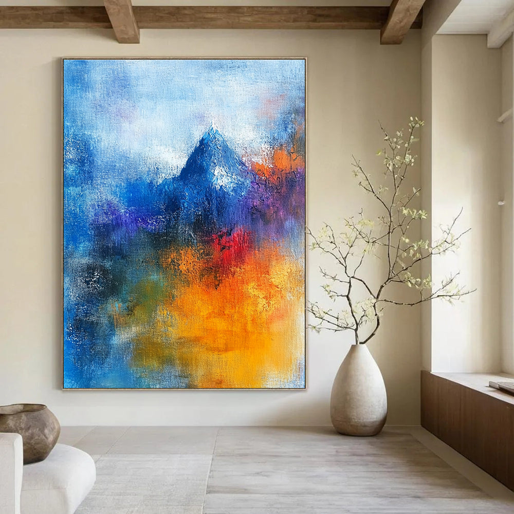 Abstract painting featuring a sacred mountain with vibrant blue and orange hues, human figures in prayer, and a blurred Christ figure, conveying deep spiritual themes.STSC249