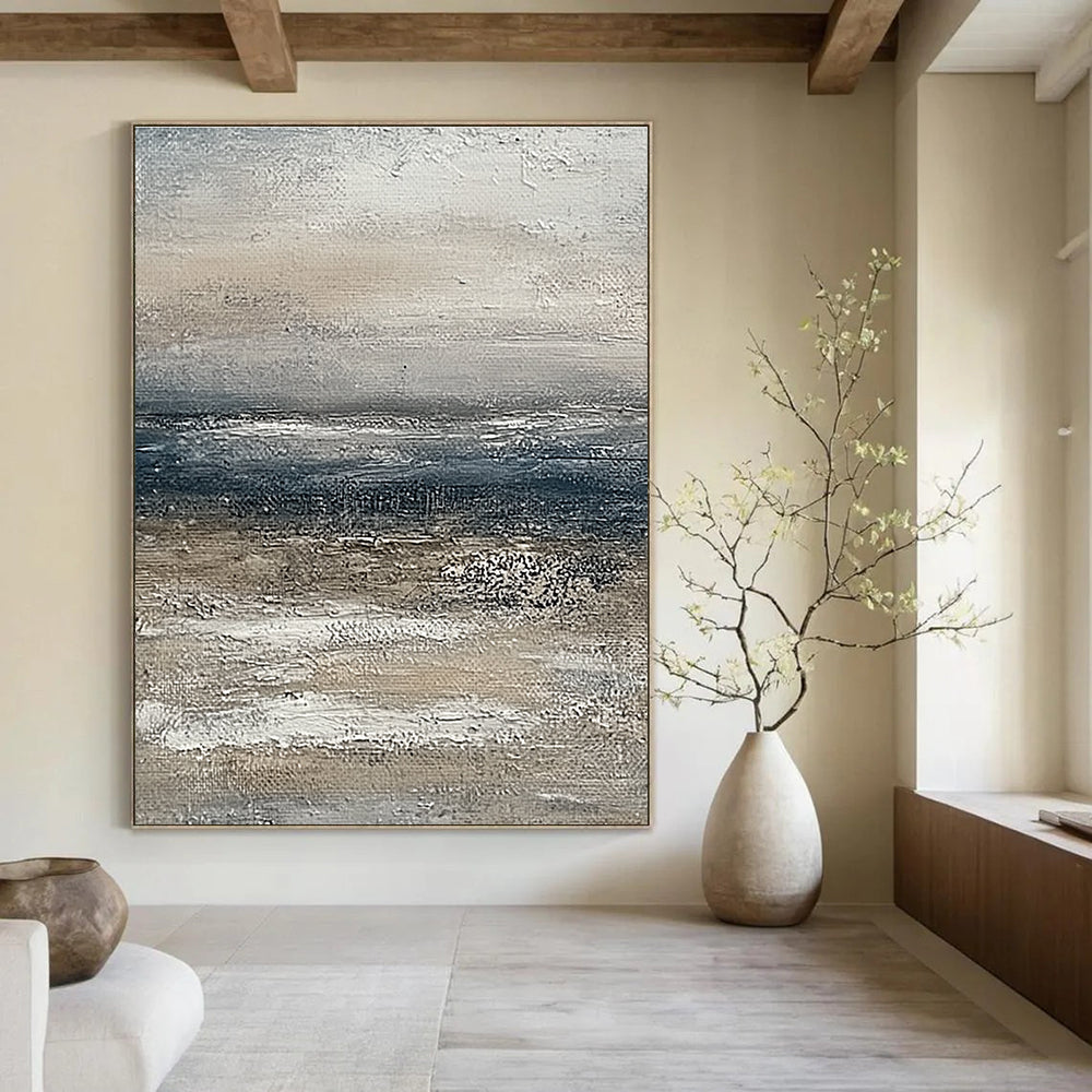 Large abstract painting of the ocean featuring muted beige and grey tones with a soft textured effect on canvas.STSC833