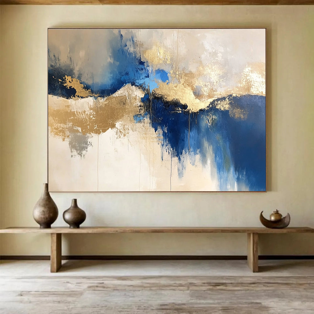 Large abstract blue and gold painting on a white background with elegant beige tones, ideal for modern decor and artistic spaces.SC022