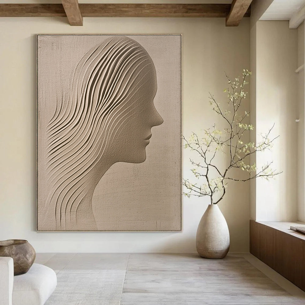 A large abstract painting featuring a sand-colored textured wall with an ethereal woman's silhouette gracefully carved into it.STSC1213