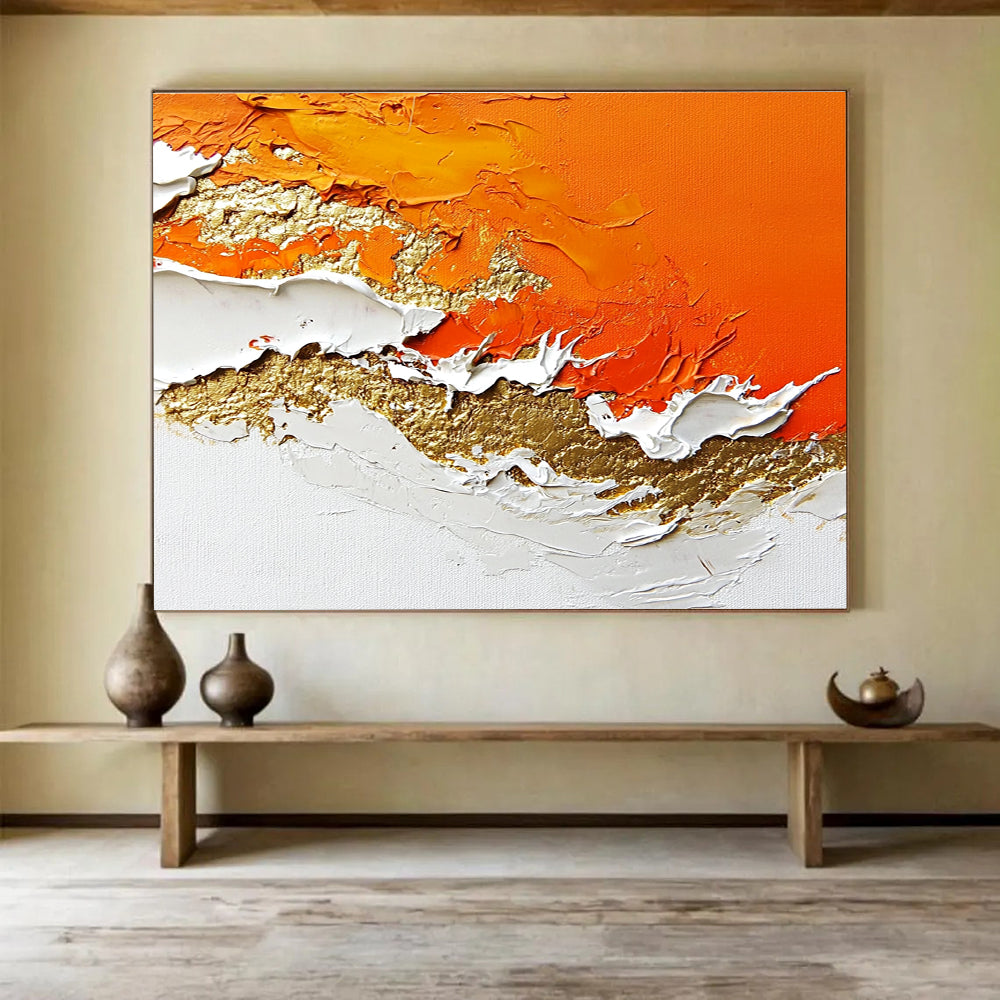 A large abstract painting with layers of orange and white enhanced by gold details and rich texture.SC325