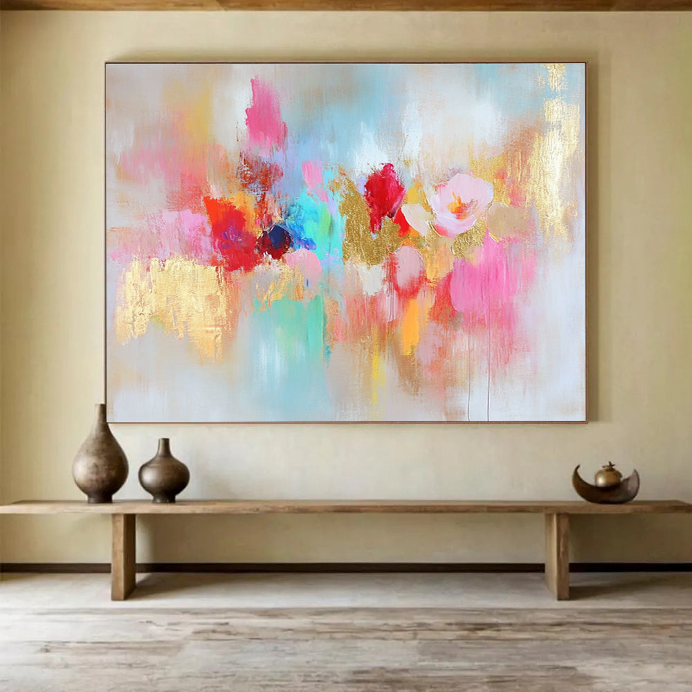 Large abstract painting with vibrant colors and gold leaf accents symbolizing happiness creativity and hope on a soft textured white background.SC264