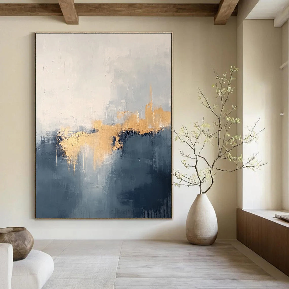Large abstract painting in grey and blue tones with gold accents creating a dreamy misty atmosphere.STSC731