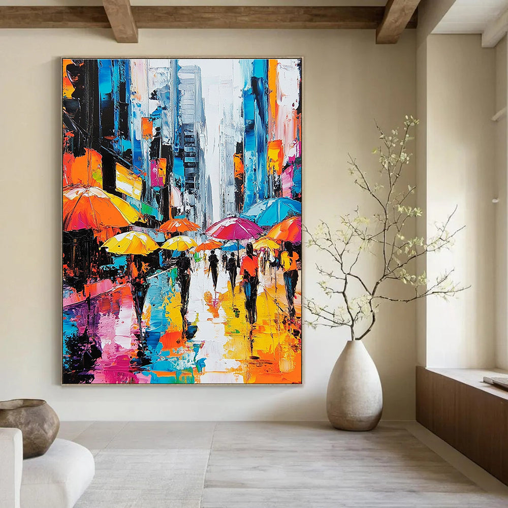 A large abstract painting depicting vibrant city streets with people under colorful umbrellas and towering skyscrapers highlighting urban energy and movement.STSC872