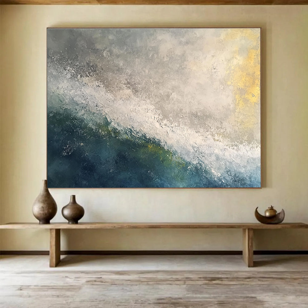 Large abstract oil painting of a stormy ocean at dawn featuring white and grey tones with touches of blue green and yellow.SC119