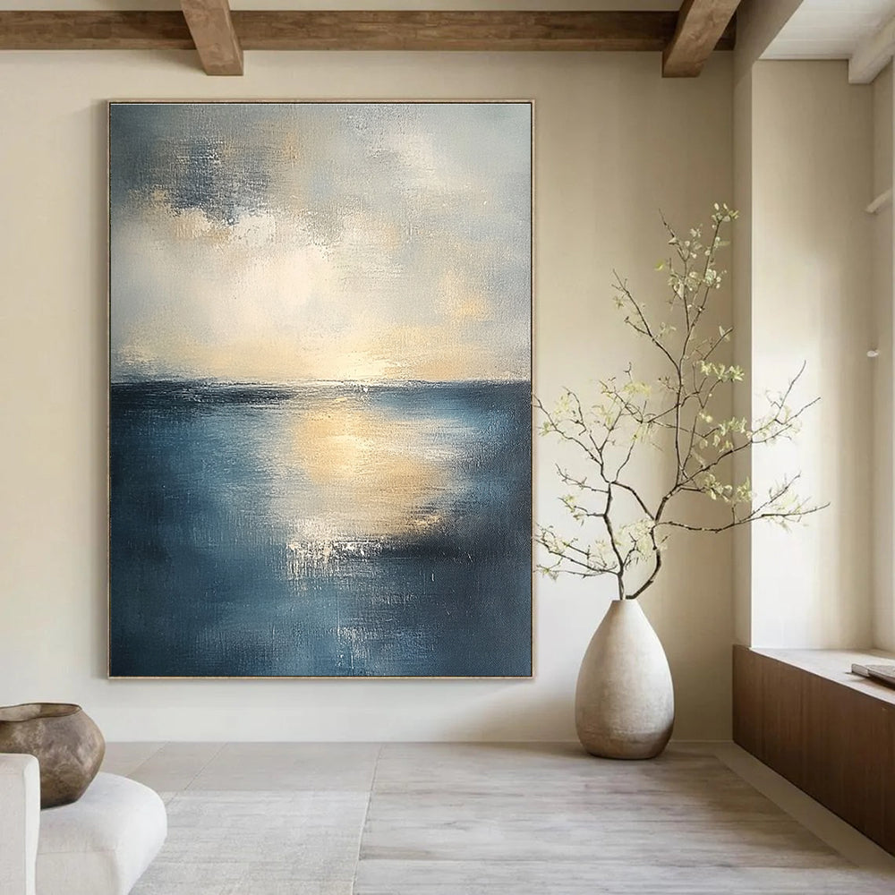 Abstract seascape in muted blue and grey tones with warm yellow sunlight evoking tranquility and reflection on canvas using soft oil paint gradients.STSC461