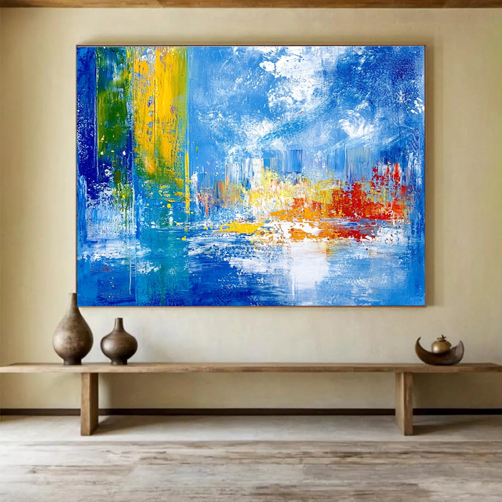 Bold abstract painting with vibrant teal yellow and red colors depicting an underwater city under sea ice against a blue sky and cloud backdrop.SC028