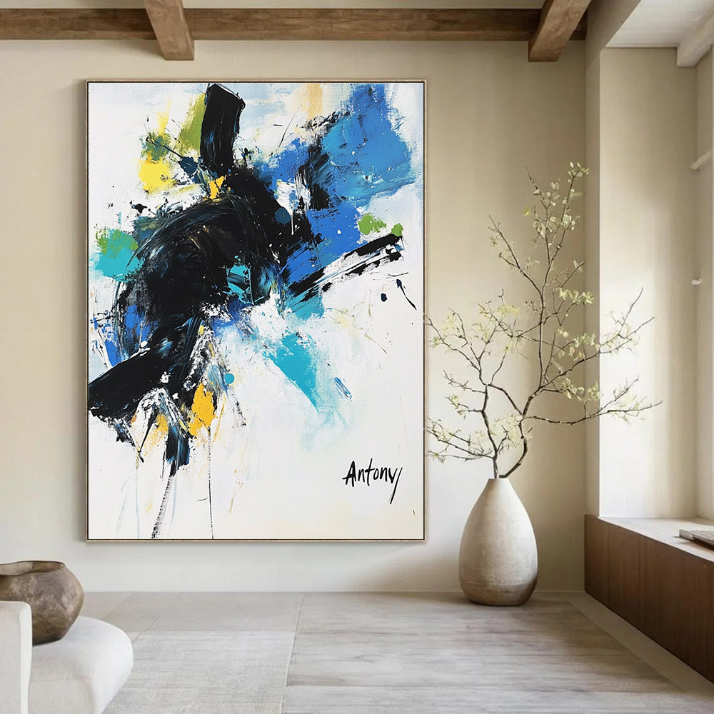 Abstract painting with black brush strokes and blue green yellow accents featuring the name Antony in large letters against a white background.STSC038