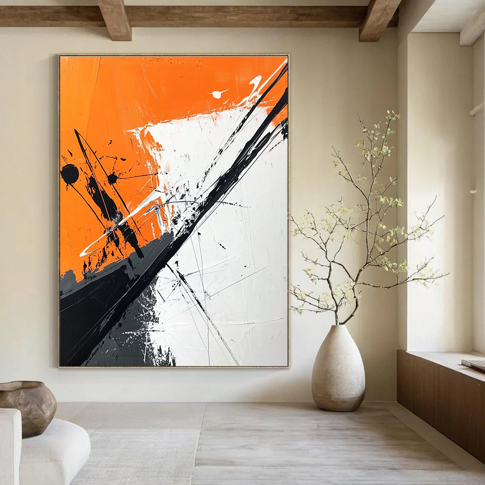 Large abstract painting features orange and white background with black brush strokes and dark gray diagonal line adding depth and artistic flair.STSC1118