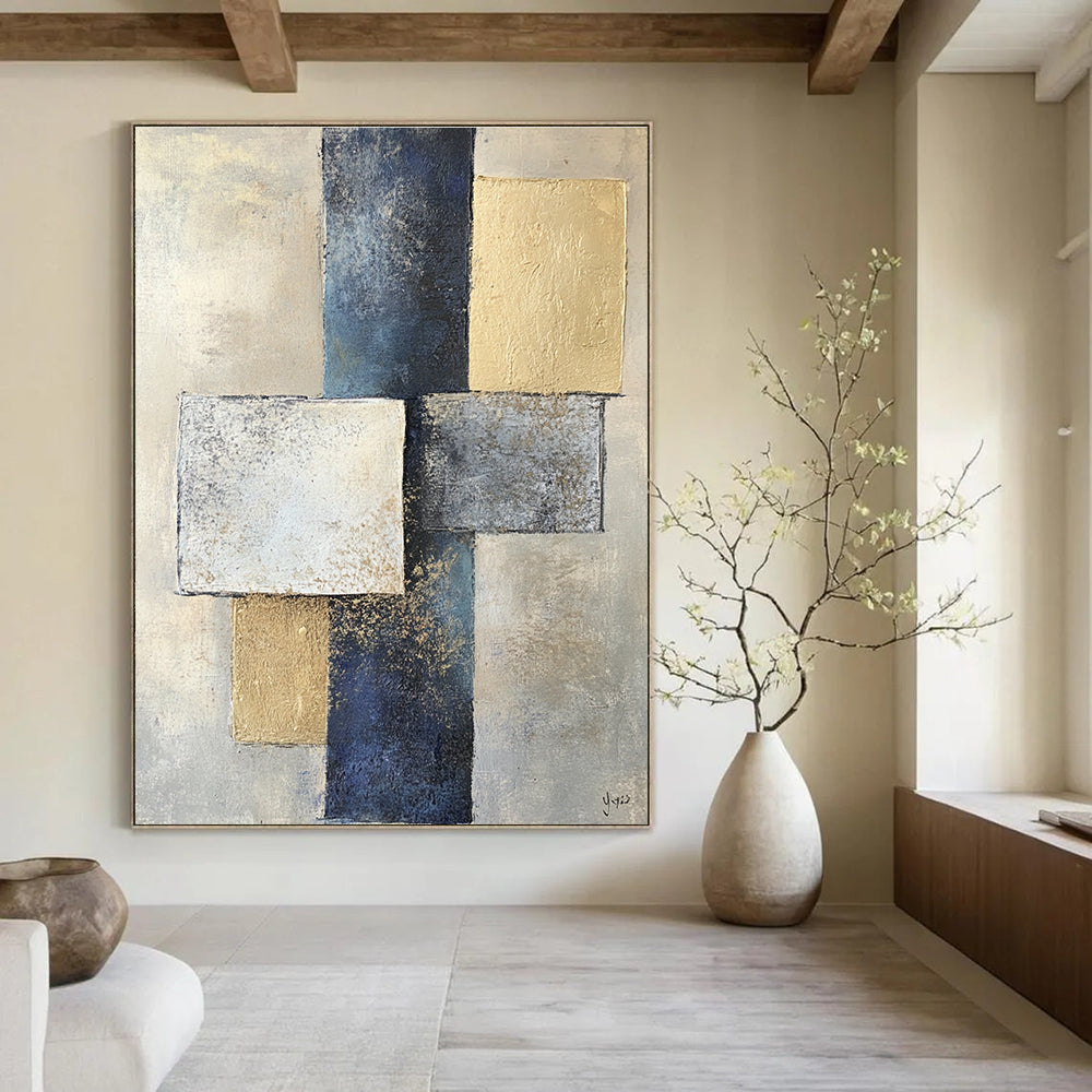 Abstract painting featuring two squares and one rectangle in varying shades of gray on textured paper with a beige and blue color palette.STSC715
