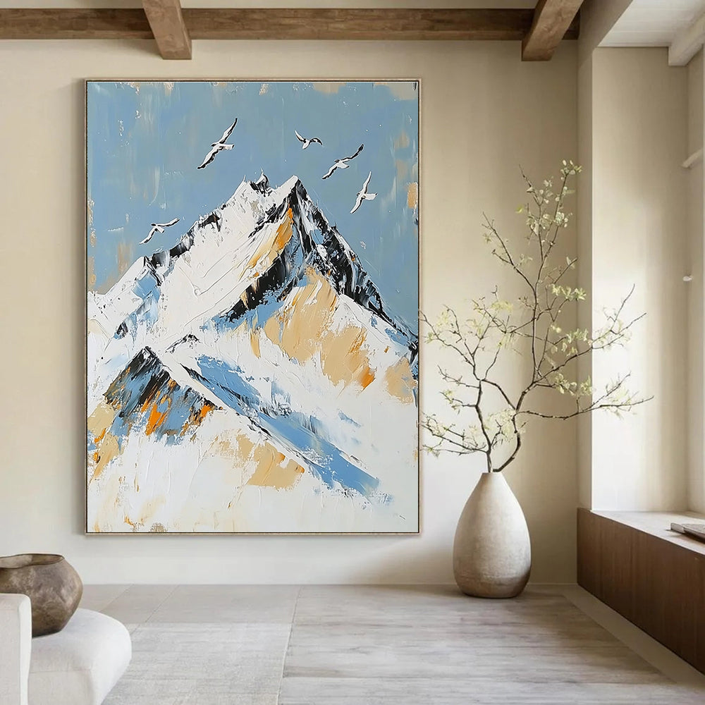 Large Abstract Painting featuring Snowy Mountain Peak with Birds in Flight accented with Gold in Elegant White and Blue Tones.STSC1365
