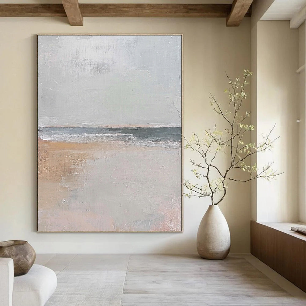 Large abstract painting in muted beige and gray tones featuring gentle brushstrokes of serene coastal scenery with hints of sandy textures and flying seagulls.STSC016