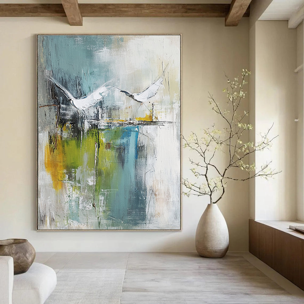 Large abstract painting of birds soaring over water in pale green and white with hints of blue beige and gray in a mixed media style.STSC303