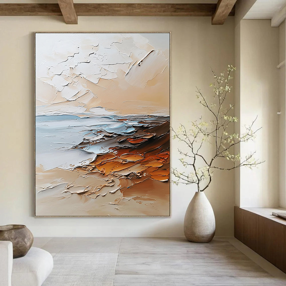 Large abstract painting in beige and white tones featuring textured brushstrokes with light orange brown and gray colors and soft edges.STSC096