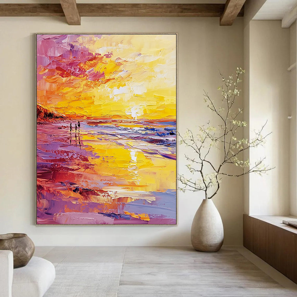 Abstract oil painting of a beach at sunset featuring a vibrant yellow and pink color scheme with small figures walking along the shore.STSC157