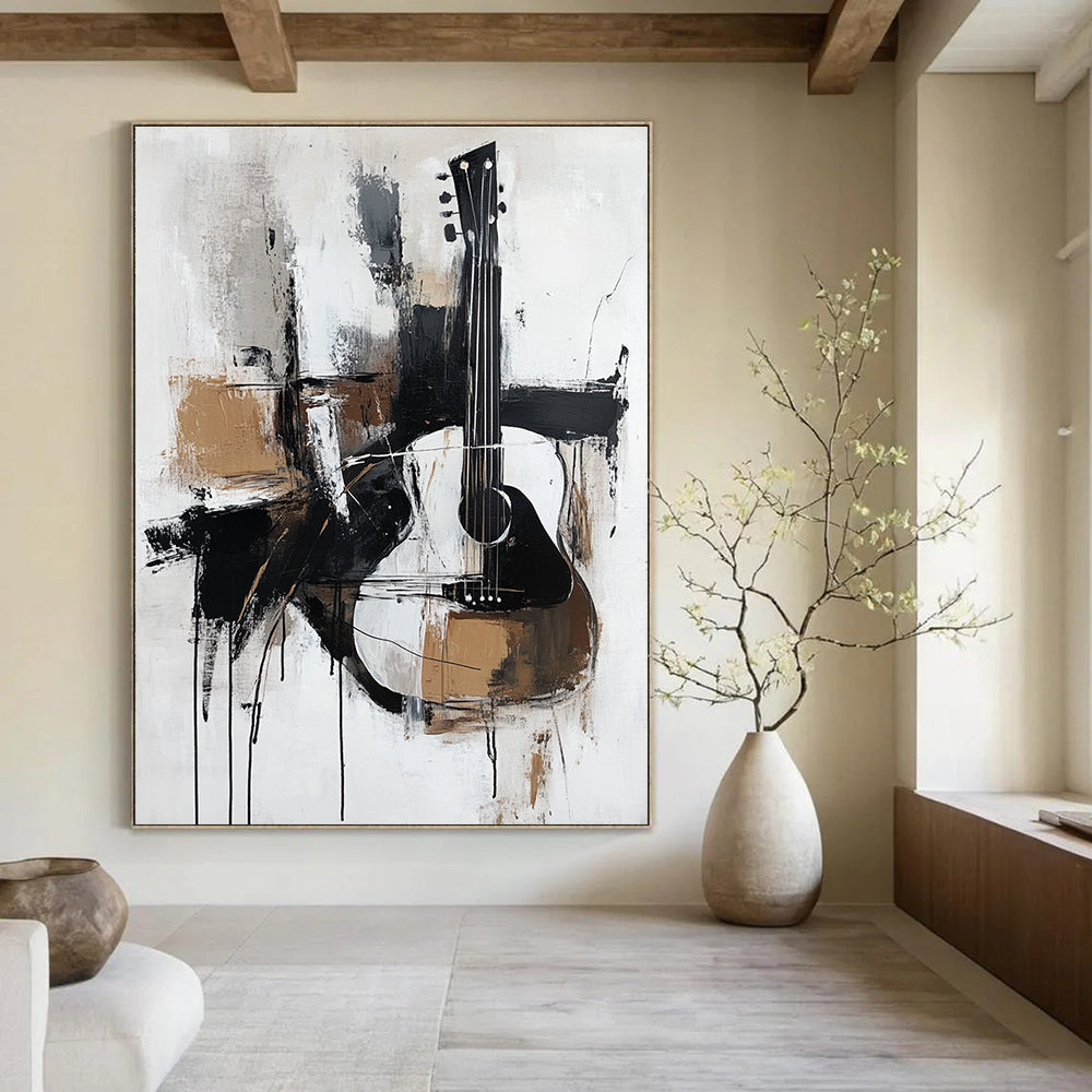 A large abstract painting featuring thick brush strokes in black white grey and brown with a minimalistic abstract guitar in elegant neutral tones.STSC818
