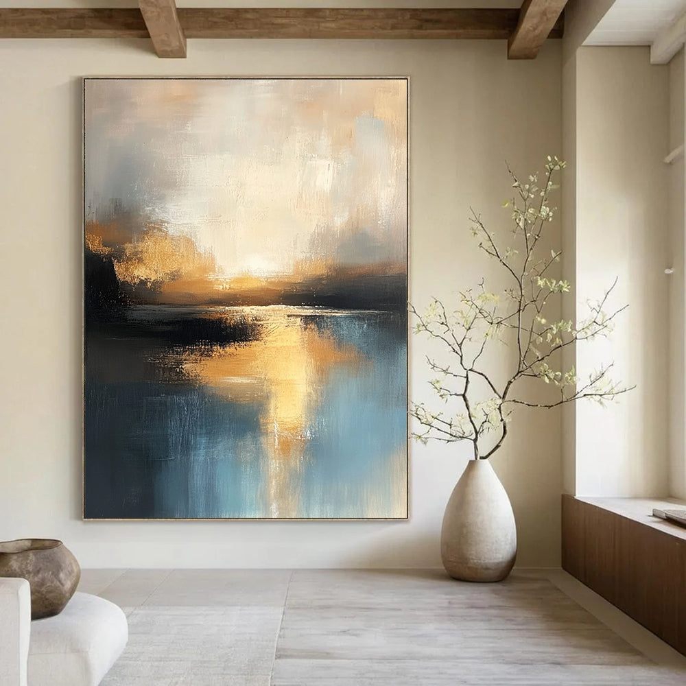 Large abstract oil painting of the sea in muted light blue and dark beige hues capturing the golden hour with textured brushstrokes and reflective water.STSC198
