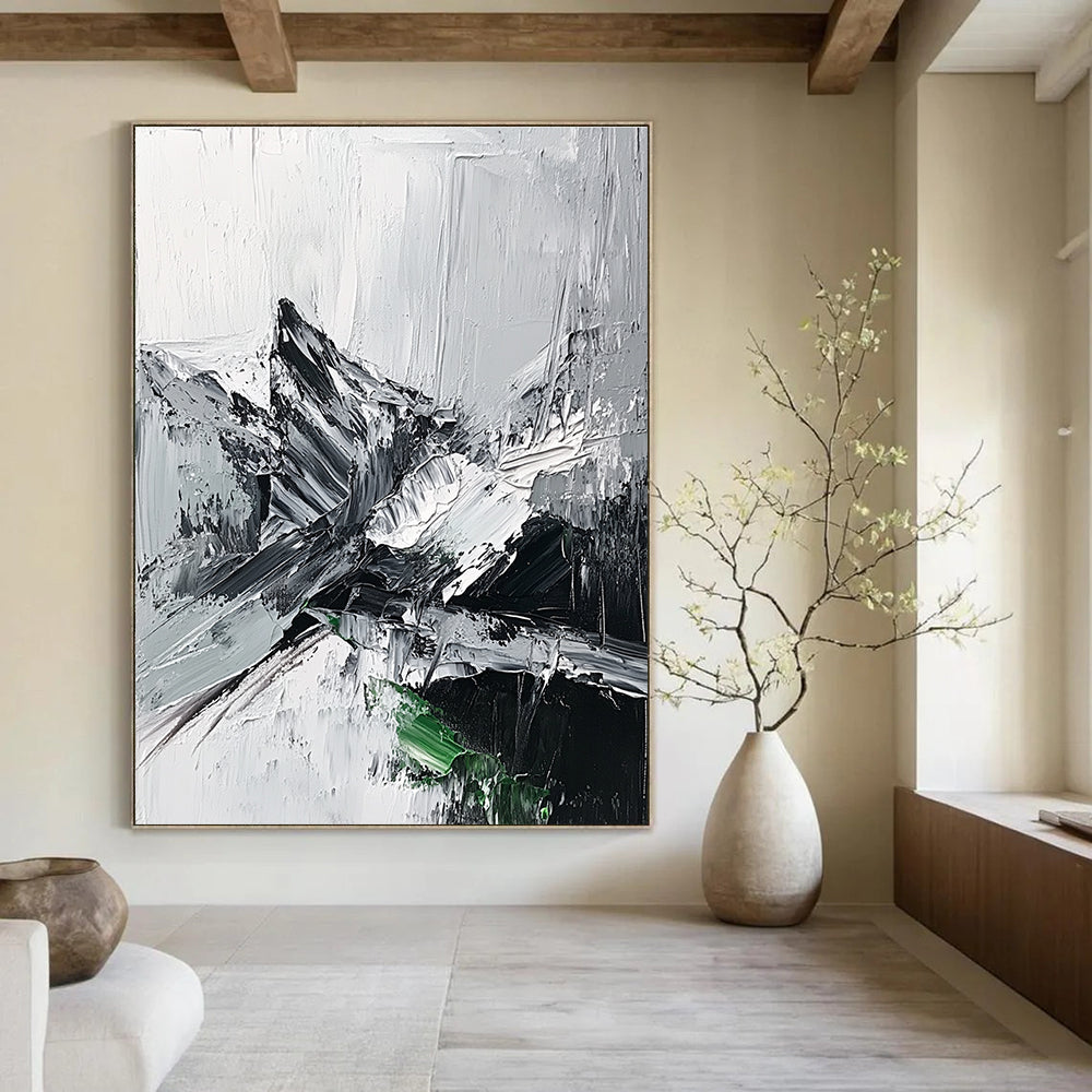Large abstract painting featuring impasto technique with thick black and white strokes depicting a misty mountain range and a small patch of snow.STSC427