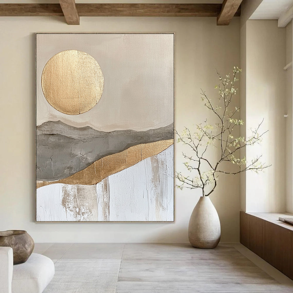 Large abstract painting featuring a golden sun and moon in a soft gray beige and white landscape with textured gold accents.STSC126