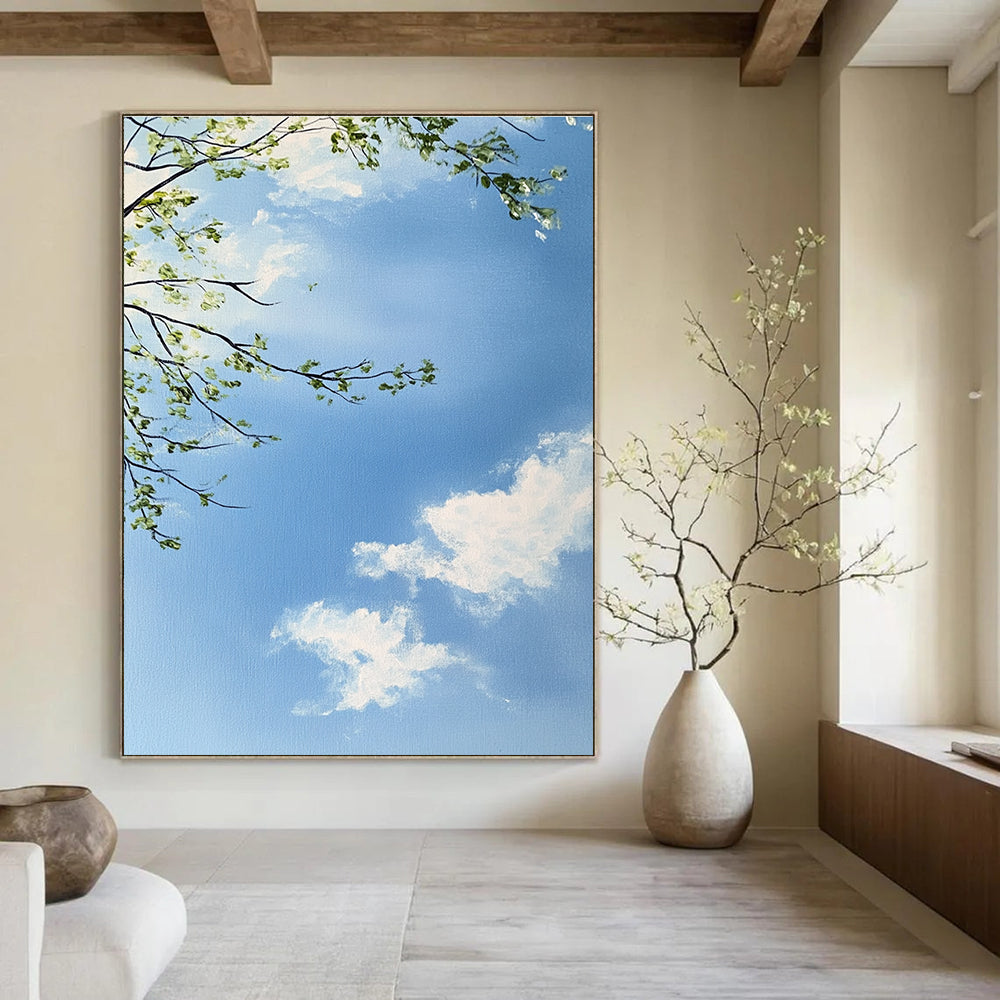 A large abstract painting capturing a serene sky with branches and leaves featuring delicate brushstrokes and soft colors for a tranquil atmosphere.STSC1195