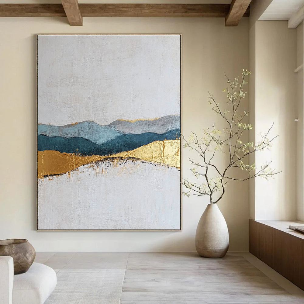 Large abstract painting featuring textured layers in neutral colors with elegant gold and blue accents for a sophisticated decor.STSC110