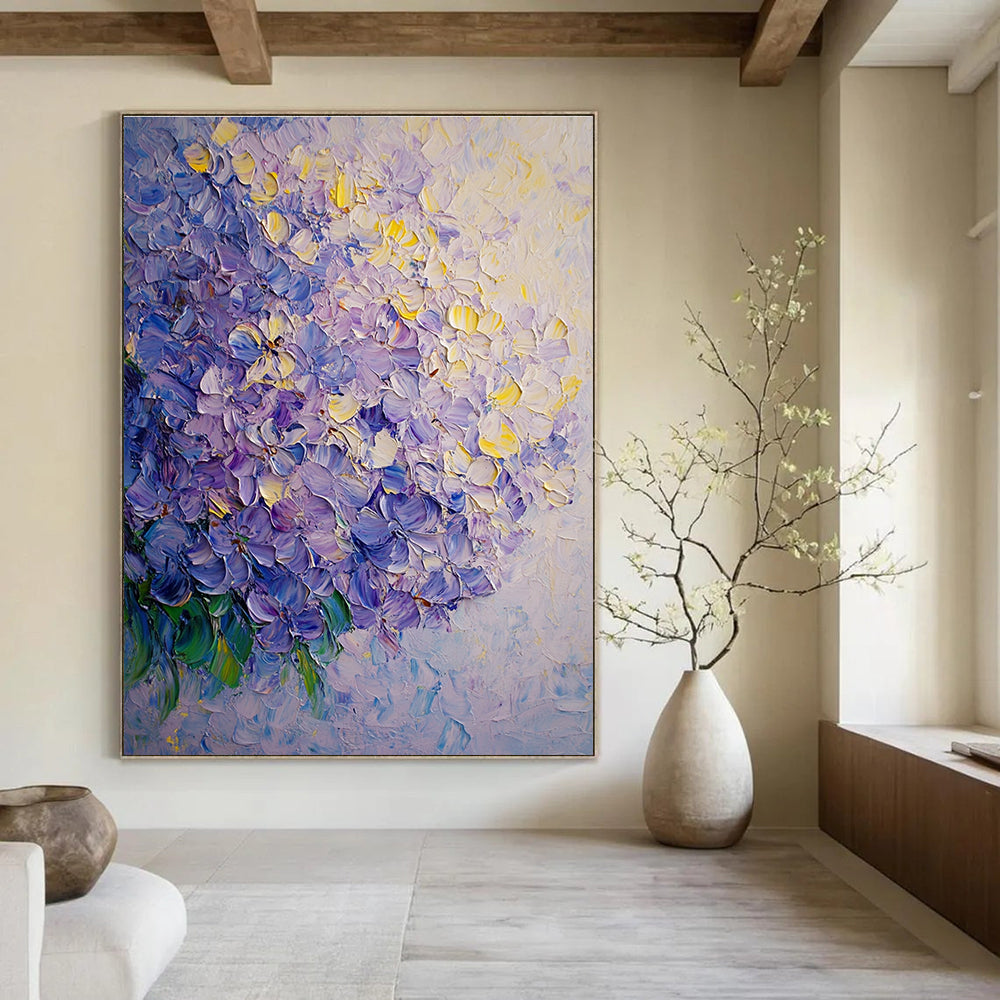 A large abstract oil painting of lilac flowers featuring soft shadows and smooth textures in light yellow and purple tones.STSC1027