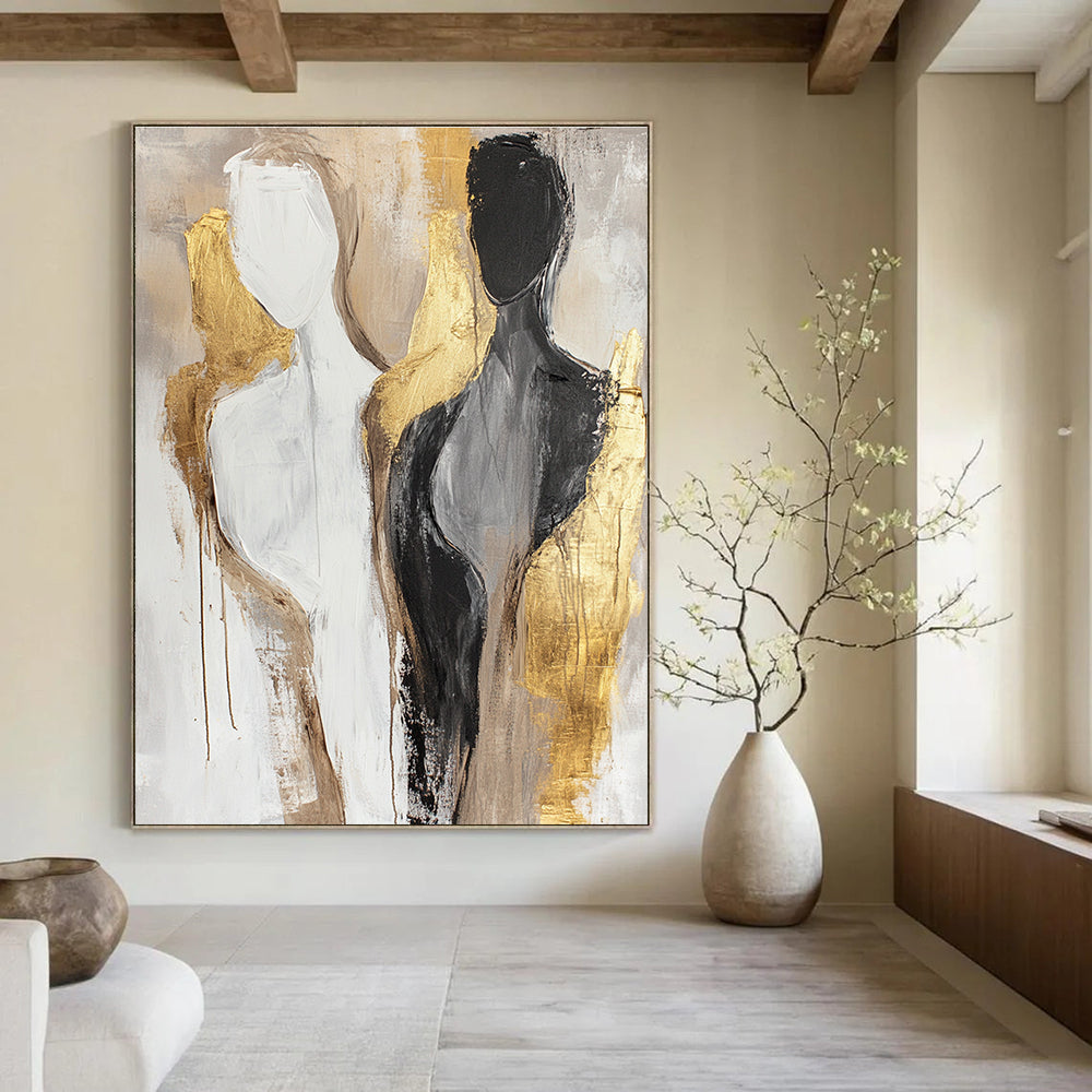 Large abstract painting featuring neutral tones and gold accents with female bodies in a minimalistic design and soft brush strokes.STSC441