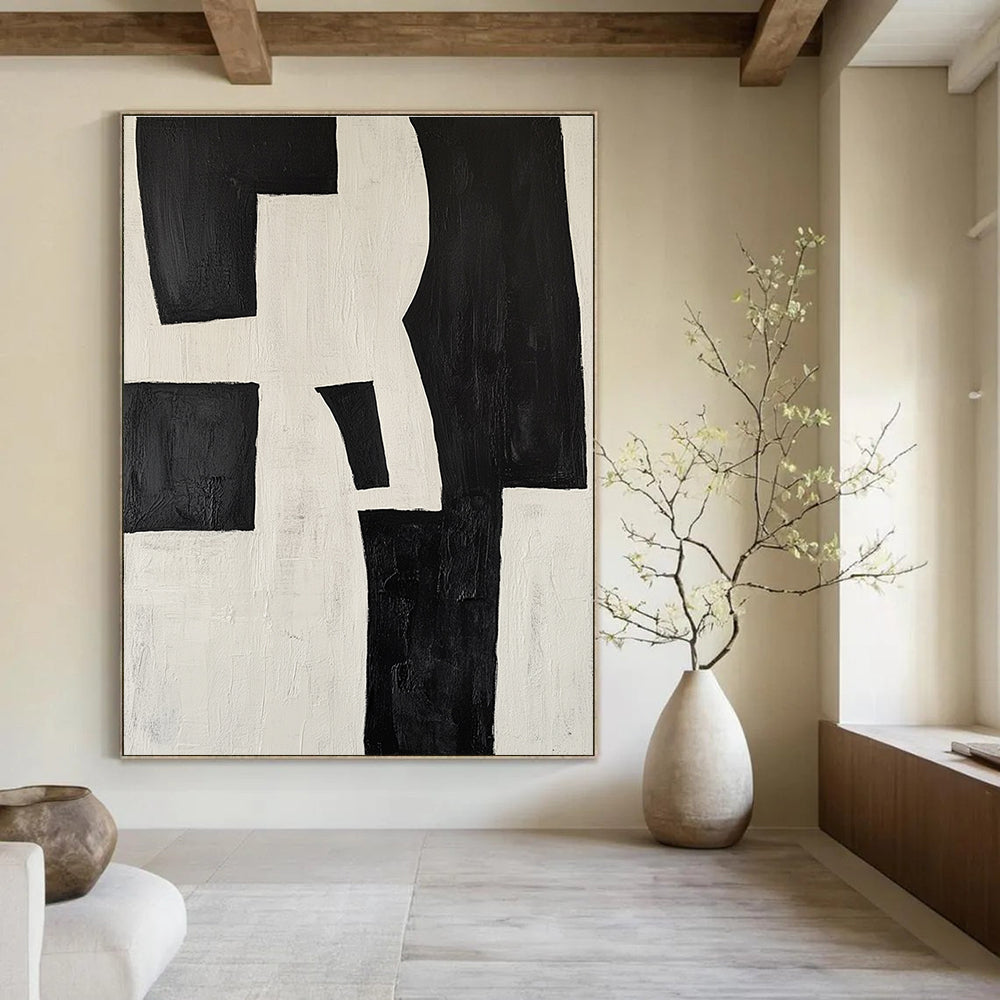 Large abstract painting in black and white featuring deconstructed shapes creating a striking visual impact ideal for modern decor.STSC389