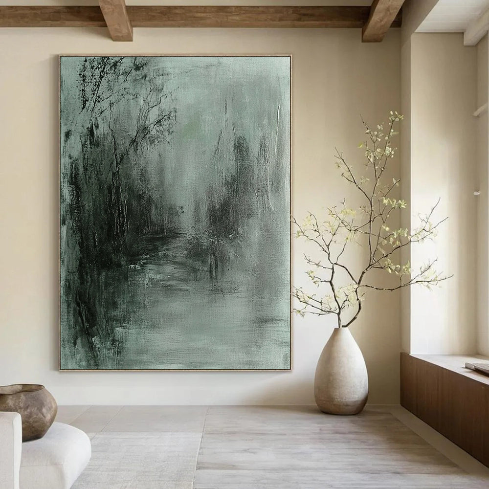 Large abstract painting in gray and green tones featuring soft edges and a dark background evokes tranquility and mystery through fluid brushstrokes.STSC419