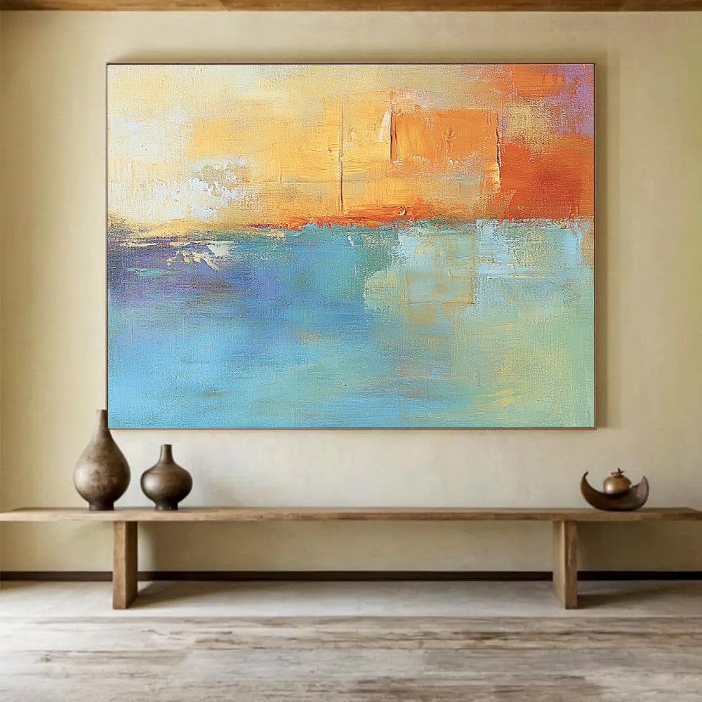 Large abstract oil painting in muted orange and aqua with soft shapes and blurred edges evoking calmness and tranquility through its impressionist style.SC124