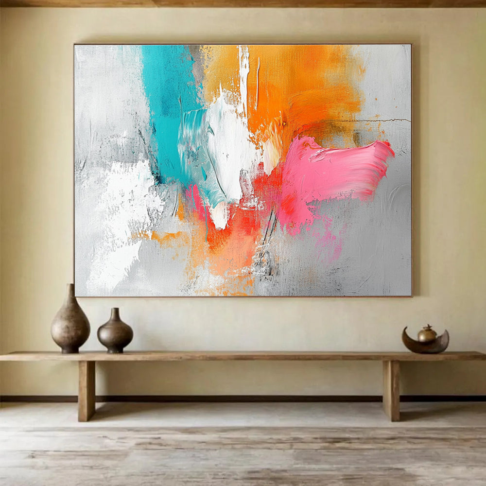 Large abstract painting featuring a light gray background with orange and pink splashes, white brush strokes, and vibrant blue accents.SC148
