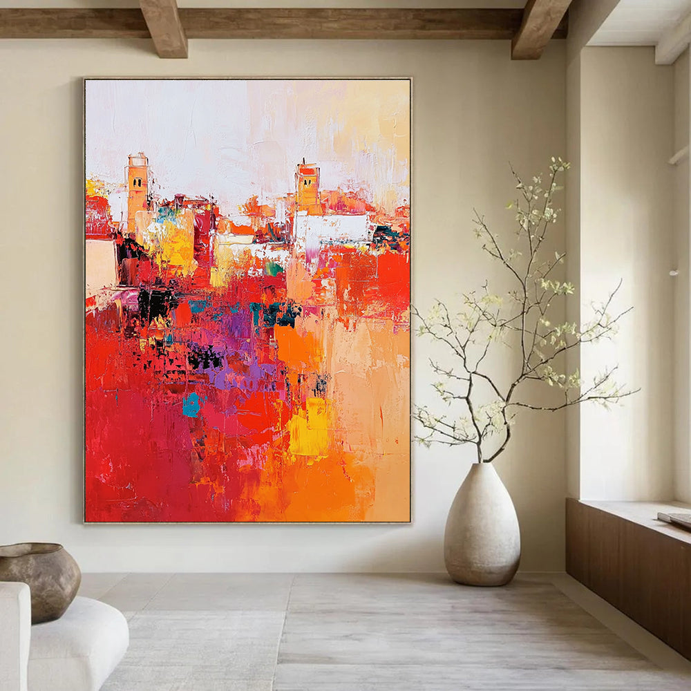 Large abstract painting depicting Marrakech cityscape with vibrant reds and oranges thick brush strokes and dynamic composition creating atmospheric lighting.STSC556