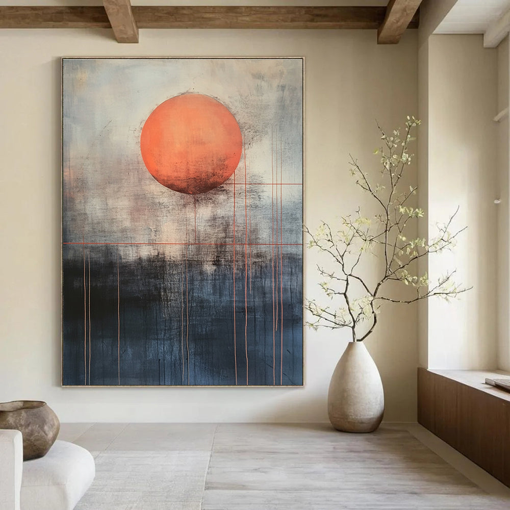 Large abstract painting featuring a mysterious orange sun above dark gray and light blue background with red lines evoking calmness and inner power.STSC1138