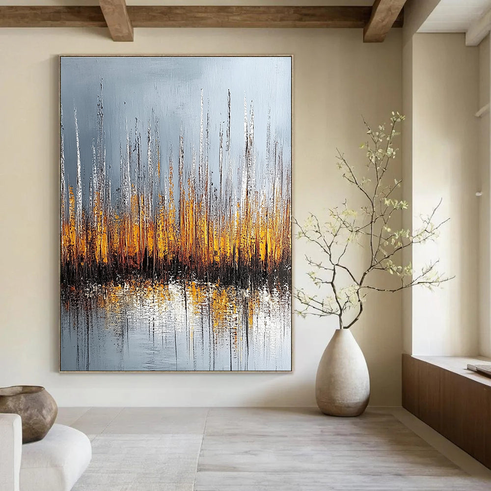 Large abstract painting of silver and gold reeds with reflections on water set against a muted gray background.STSC330