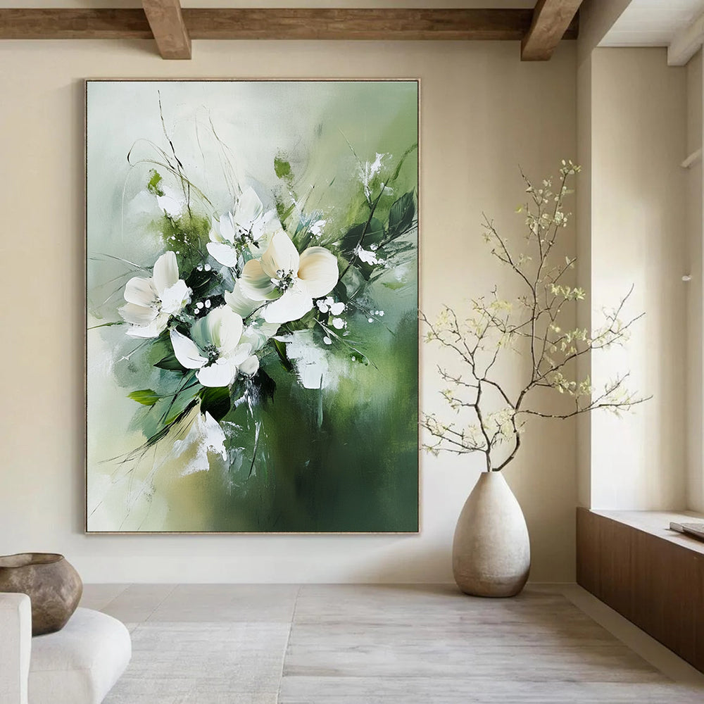 Large abstract painting featuring white flowers and green leaves in neutral tones against a soft green blurry background.STSC365
