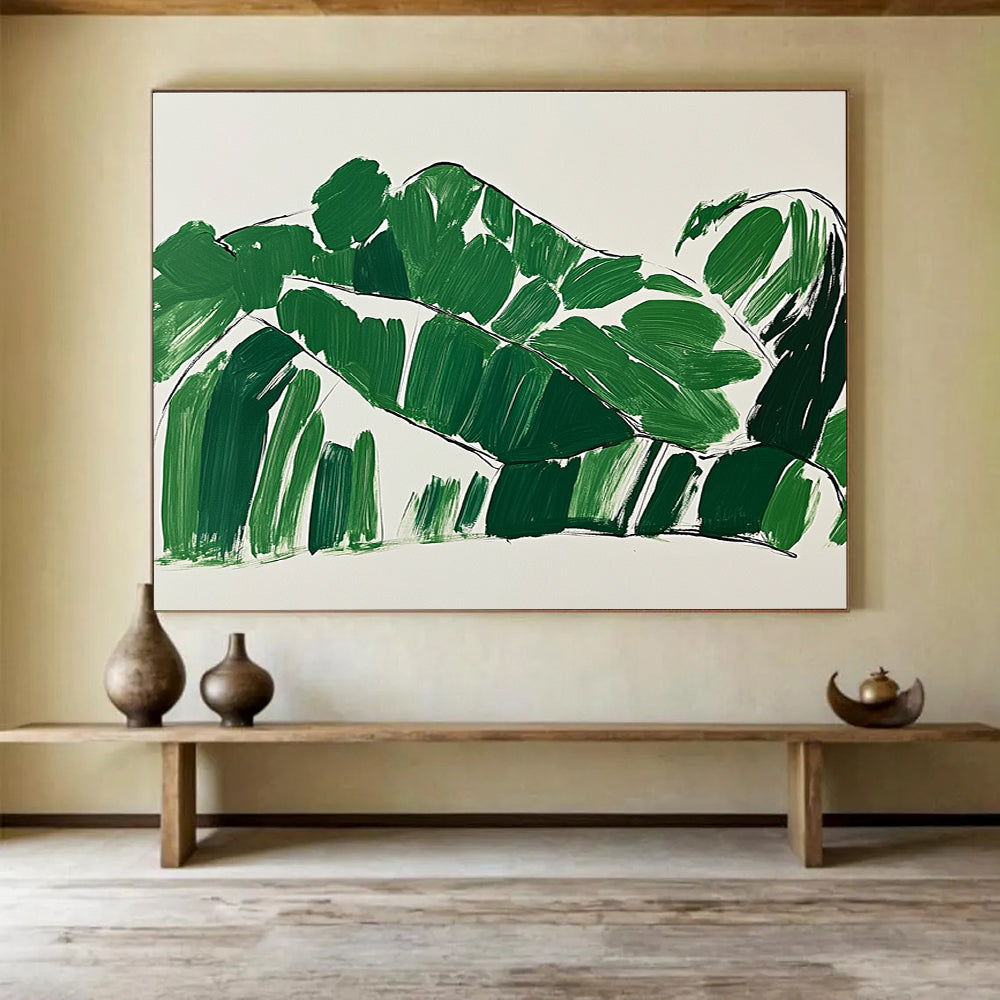 A large abstract painting featuring green leaves in the shape of a woman lounging on a couch with minimalist brush strokes on a white background.SC551